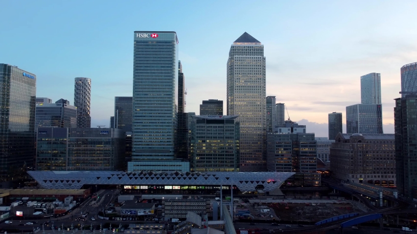 Cinematic symmetrical drone shot of skyscrapers in London at sunset Royalty-Free Stock Footage #1096361727