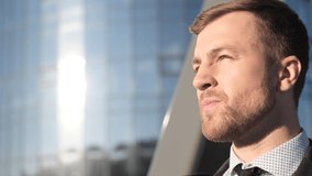Office manager closes his eyes and looks at the sun, business man. 4k video