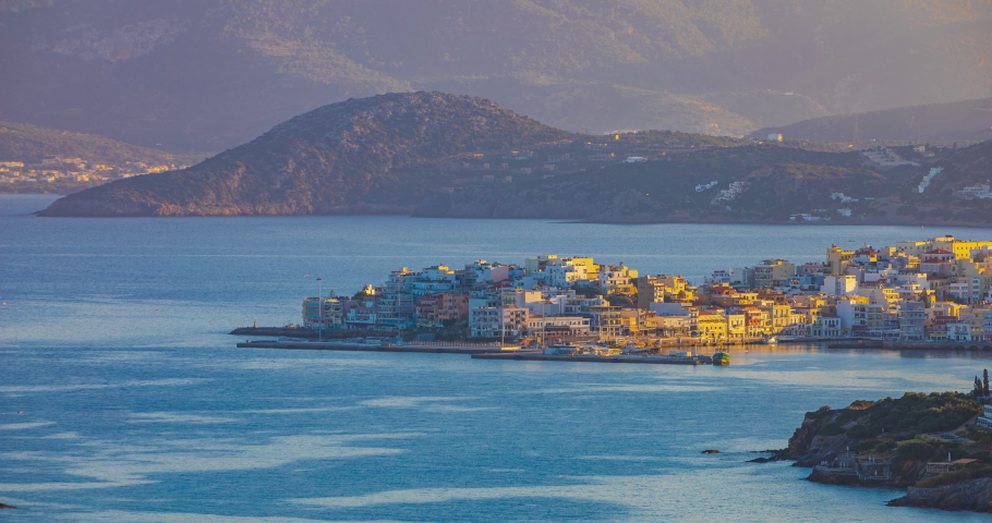 Sunset over Agios Nikolaus.  Agios Nikolaos, Crete, Greece, day to night, time lapse.
