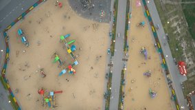  Children play on the playground. Top view of the playground. People are moving. Timelapse. Aerial drone video footage