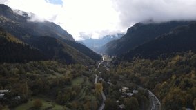 Aerial video footage of a gorgeous valley surrounded by mountains in autumn.