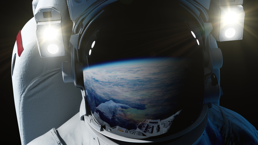 
Astronaut spaceman floating in outer space looking at the Earth globe planet. reflection of earth view in helmet. science or space travel background | Shutterstock HD Video #1096380227