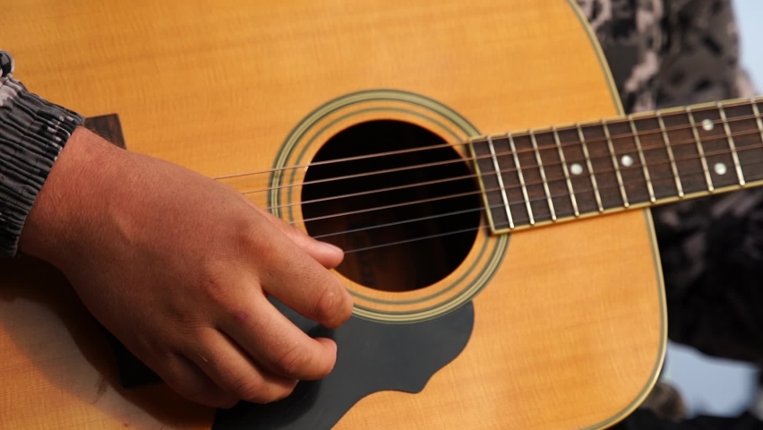Close up man's hand playing the guitar Royalty-Free Stock Footage #1096382217