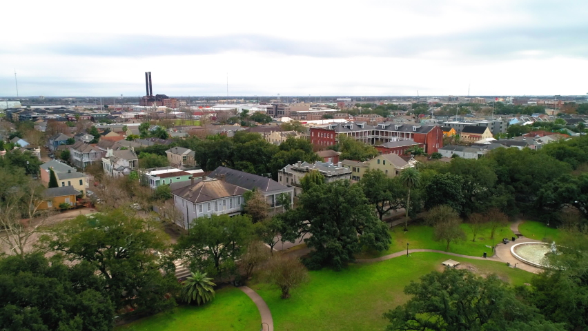 Aerial Forward Shot Of Residential Bungalows In City Against Cloudy Sky - New Orleans, Lousiana