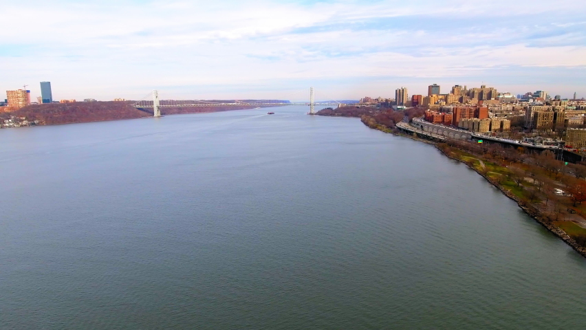 Aerial Backward Shot Of Famous Suspension Bridge On East River In Residential City - New York, New York Royalty-Free Stock Footage #1096389461