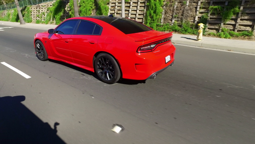 Point Of View Of Red Car Moving On Road During Sunny Day - Long Beach, California