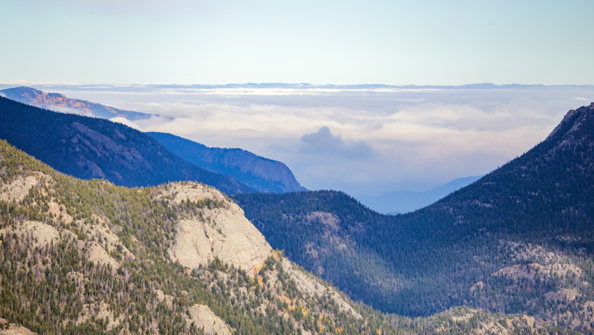 Aerial Lockdown Time Lapse Shot Of Clouds Moving Over Mountain Range At National Park - Rocky Mountain National Park, Colorado