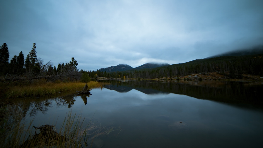 Time Lapse Lockdown Shot Of Reflection Of Clouds In Lake At National Park - Rocky Mountain National Park, Colorado