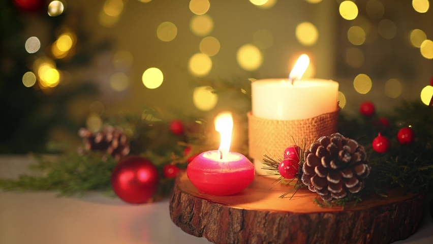 Lights candles on christmas night. winter holidays concept. celebrating new year at home. | Shutterstock HD Video #1096408121