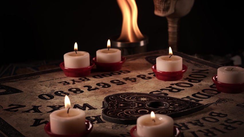 The Spiritual Witchcraft Ouija Board in Candle Light  Royalty-Free Stock Footage #1096409127