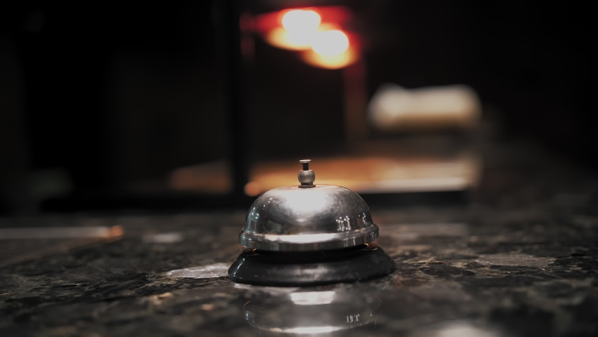 Silver Call Bell. close-up. hand presses service bell on the counter in the restaurant bar Royalty-Free Stock Footage #1096409355