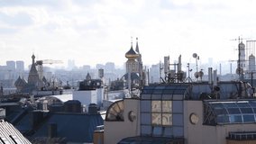 Moscow cityscape in a sunny day. Panoramic view of rooftops in downtown district with Moscow Kremlin and Saint Basil's Cathedral. Real time video. Selective focus. Travel in Russia theme.