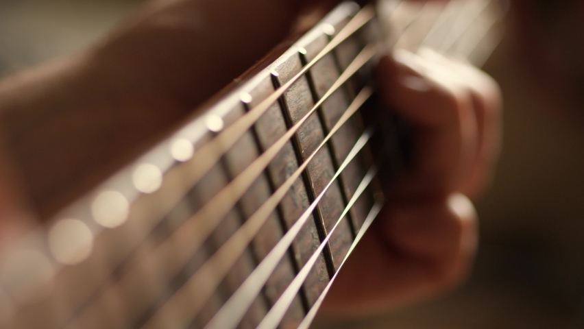 Acoustic guitar solo fingers on fretboard macro, guitar player playing music Royalty-Free Stock Footage #1096414567