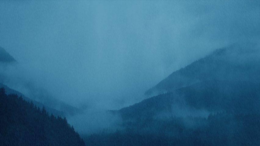 Heavy Rain Over Vast Mountain Landscape