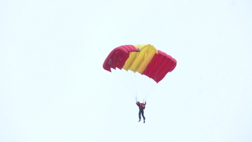 A member of the parachute team descending for a parachute jumping demonstration.
 Royalty-Free Stock Footage #1096424185