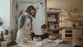 Mother and son cooking biscuits together - Powered by Shutterstock - Get 15% off with code: PIKWIZARD15