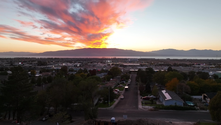 Freeway traffic under a beautiful sunset over utah lake