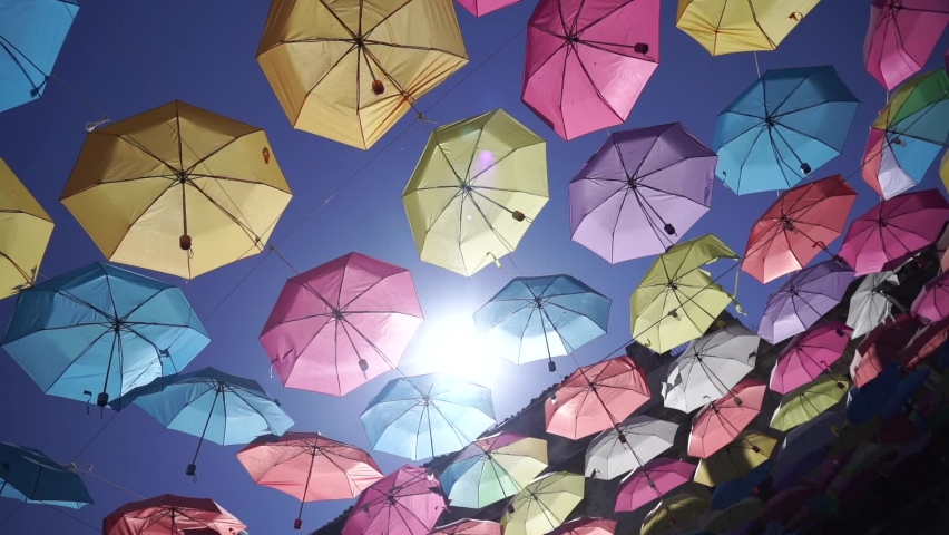 Colorful umbrellas background. Colorful umbrellas in the sky. Street decoration