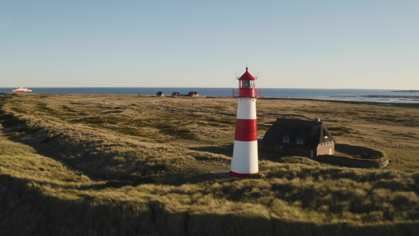 Sylt, Lighthouse Ellenbogen, northernmost point of Germany. Schleswig-Holstein, North Sea. 4K drone. Beautiful tourist destination and attraction from above. Royalty-Free Stock Footage #1096442087