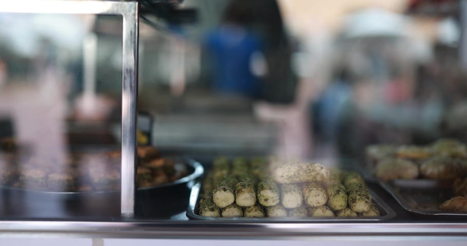 Traditional oriental sweets baklava inside showcase at local market