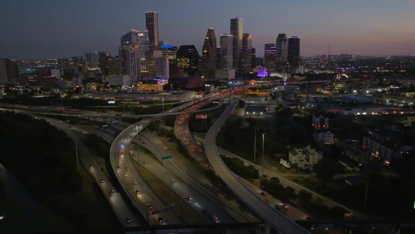 Aerial view towards the Illuminated skyline of Houston city, dusk in Texas, USA