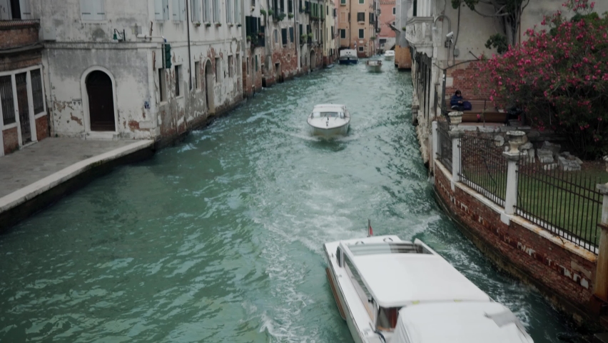 Motorboats Sailing In The River At The City Of Venice, Italy. Wide Shot