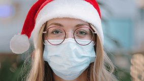 Close up female portrait Caucasian woman lady girl nurse doctor wearing red Santa Christmas hat cap and eyeglass and protective medical face mask New Year xmas pandemic coronavirus covid ill sick - Powered by Shutterstock - Get 15% off with code: PIKWIZARD15