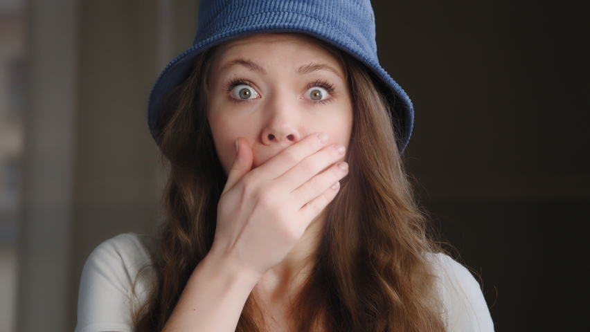 Female portrait young frightened surprised woman shocked by unpleasant news excited girl student with wide eyes scared hears bad secret feels shock stress fear reaction to information fear of problem | Shutterstock HD Video #1096481883