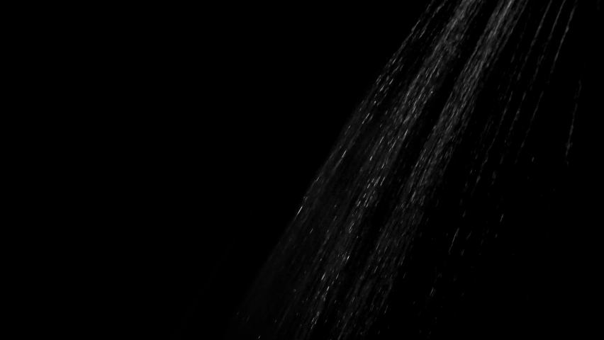 Water flows from the shower on a black background. Overlay template.