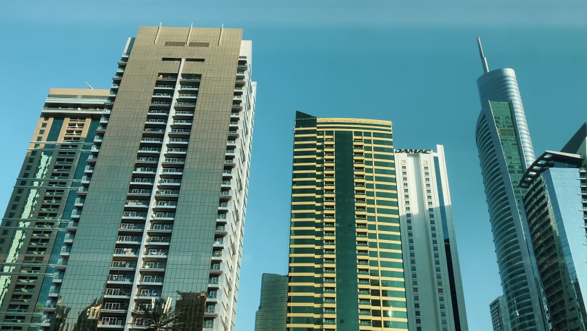 Skyscrapers View from metro dubai. Subway in Dubai Skyscrapers downtown near Sheikh Zayed road. Travel tourism business in United Arab Emirates. High quality 4k footage