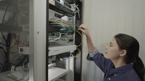 Server room, Data Center, Beautiful woman working and checking cables on Server Cabinets or Server Rack. - Powered by Shutterstock - Get 15% off with code: PIKWIZARD15