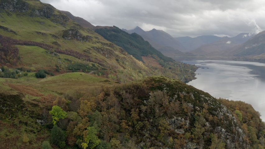 An aerial view of the east end of Loch Duich in the Northwest Highlands of Scotland in Glen Shiel on an overcast day. Flying left to right from the north side of the loch.