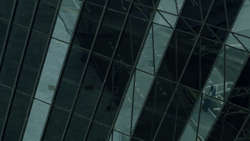  Black glass office. Stock footage. Black windows of a tall building at a height that is made in a certain style.