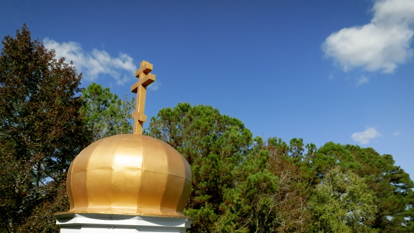 The golden spire of a Russian orthodox church.