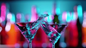Super Slow Motion of Martini Cocktails Hitting Together in a Bar, Cheers Concept. Filmed on High Speed Cinema Camera - Powered by Shutterstock - Get 15% off with code: PIKWIZARD15