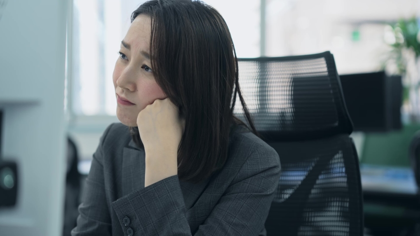 Asian woman worrying in office. Royalty-Free Stock Footage #1096513927