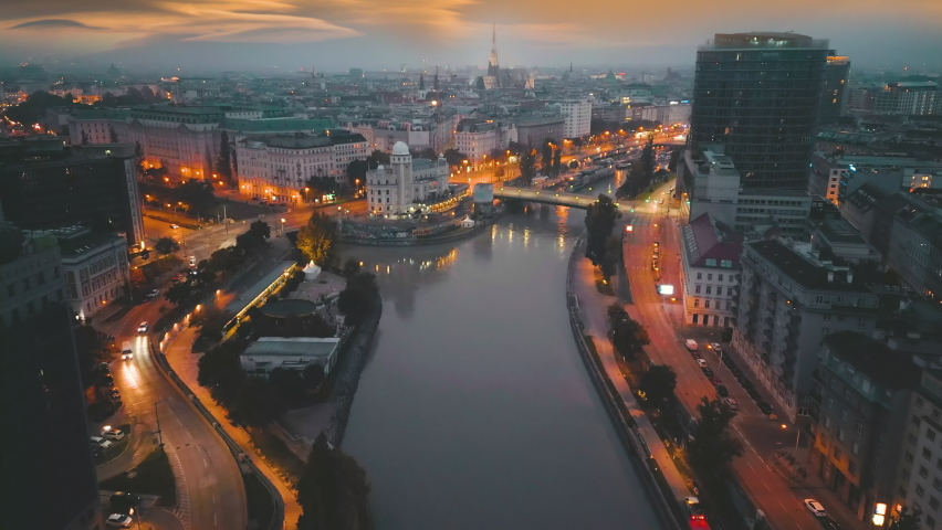 Vienna skyline aerial view at night, Austria Vienna night downtown view from sky, vienna cathedral church old town and new buildings at sunrise river donau top panoramic view.