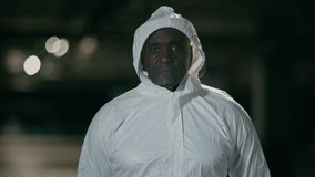 Upset unhappy tired man posing on dark background serious male doctor medical laboratory worker lifeguard in white protective chemical suit uniform looking at camera with sad frustrated expression - Powered by Shutterstock - Get 15% off with code: PIKWIZARD15