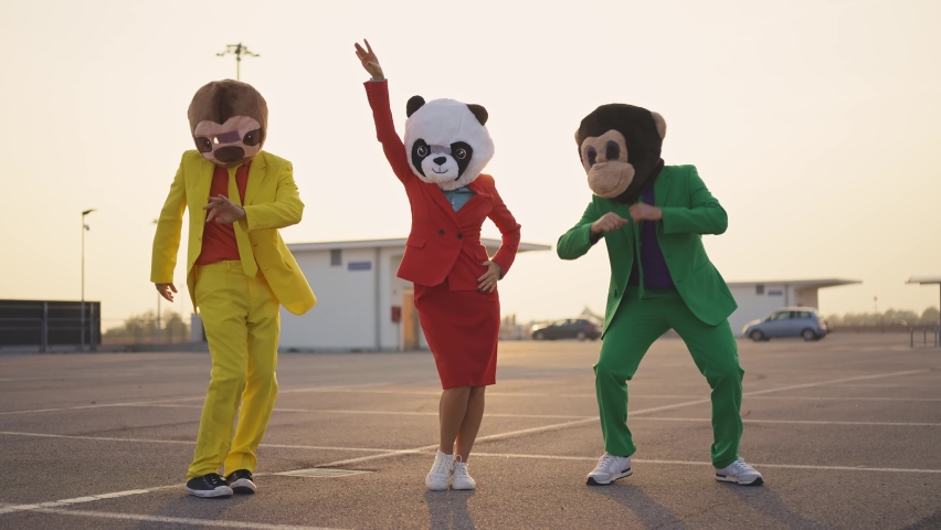 cinematic and storytelling video of a group of friends having fun and celebrating outdoor wearing funny mascots costumes	 Royalty-Free Stock Footage #1096519401