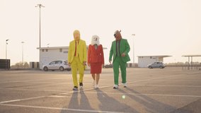 cinematic and storytelling video of a group of friends having fun and celebrating outdoor wearing funny mascots costumes	