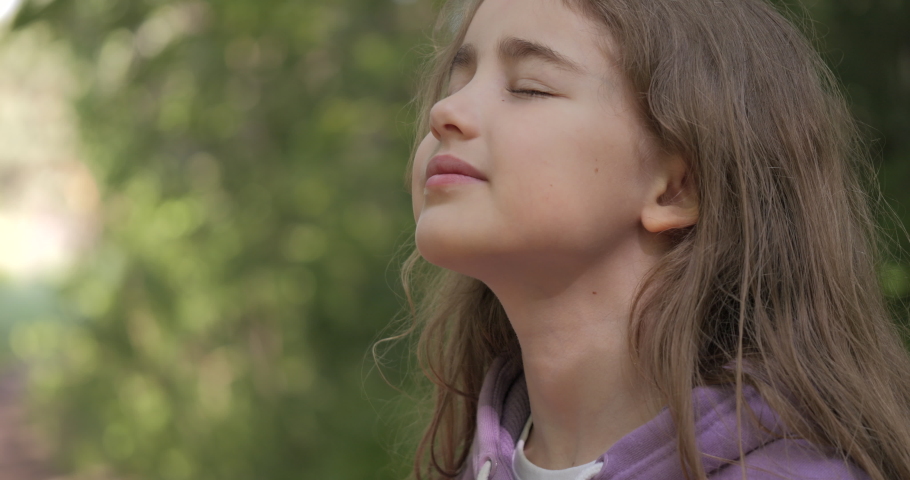 Portrait Child Girl Exhaling Fresh Air, Taking Deep Breath, Reducing Stress in Forest. Dreamy Peaceful Relaxed Smiling Teenager Girl Breathing Fresh Air Nature, Tranquil Caucasian Child Alone Outdoors Royalty-Free Stock Footage #1096527205