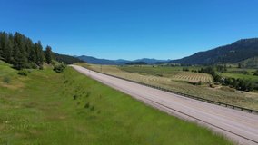 Aerial View of Car Driving By Scenic Highway in Chewelah, WA
