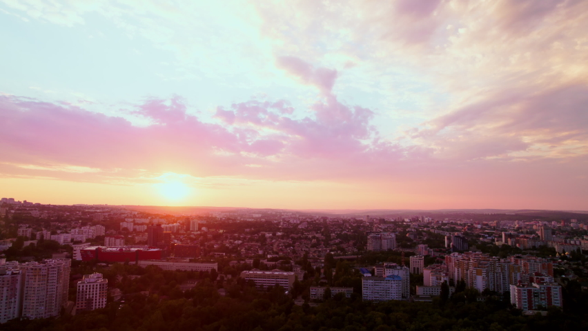 Drone filming of a sunset full of life in a city in central Europe. High resolution video. 4K. Royalty-Free Stock Footage #1096535819