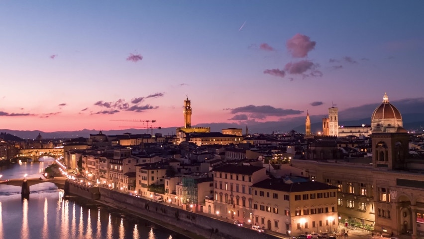 Aerial panoramic view of Florence Cathedral, Firenze Cattedrale di Santa Maria del Fiore, Ponte Vecchio and Arno River on a beautiful colourful sunset sky, Tuscany region of Italy Florence Royalty-Free Stock Footage #1096539045