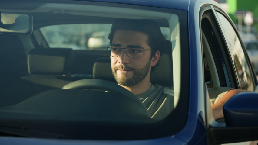 Man Driver Sitting in Car close-up, Traffic Jam. Car Sharing concept, Vehicle and Transport. Young Guy Driving. Traveling by Automobile, rush hour.  Royalty-Free Stock Footage #1096540467