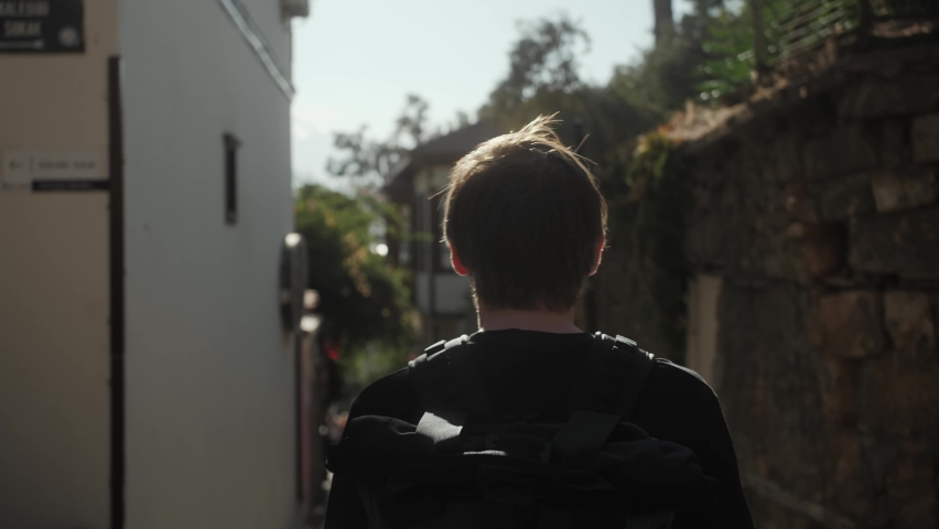 Happy tourist man in Barcelona, Spain. Vacation exploring interesting places to travel, student vacation, young man portrait. 