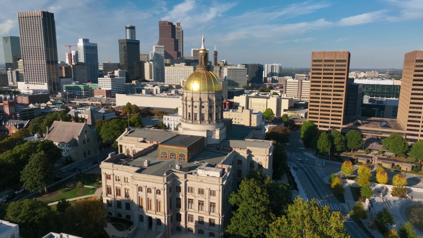 State capitol building in Atlanta Georgia. Capitol dome in Georgia. State of Georgia government building. Downtown skyline in distance. Aerial orbit. Royalty-Free Stock Footage #1096544269