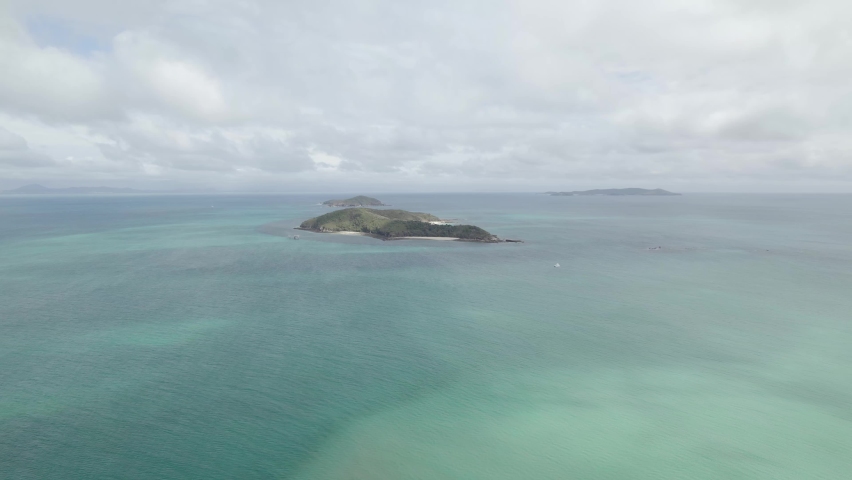 Middle Island And Miall (Ma-ma-lon-bi) Island Surrounded With Coastal Waters Of Great Barrier Reef In The Keppels, QLD, Australia. - aerial