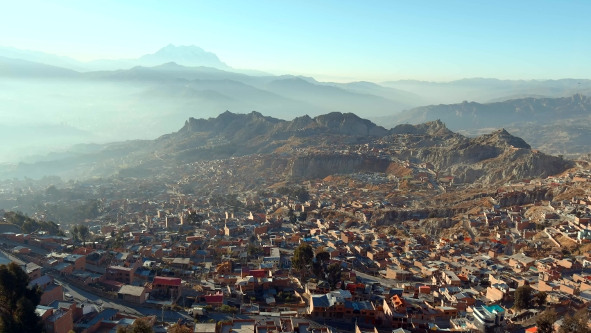 Beautiful cities of El Alto and La Paz in the Andes Mountains of Bolivia. Beautiful panoramic view with the Andean mountain range in the background. Royalty-Free Stock Footage #1096546341