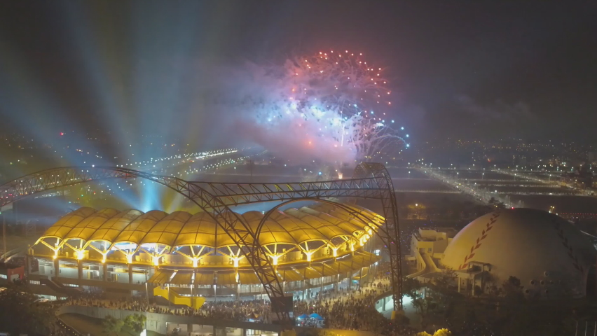Taichung, Taiwan - aerial view of Taichung Intercontinental Baseball Stadium at Taichung City, Taiwan, Asia. Night aerial view of a colorful fireworks and light over the stadium. Royalty-Free Stock Footage #1096549815
